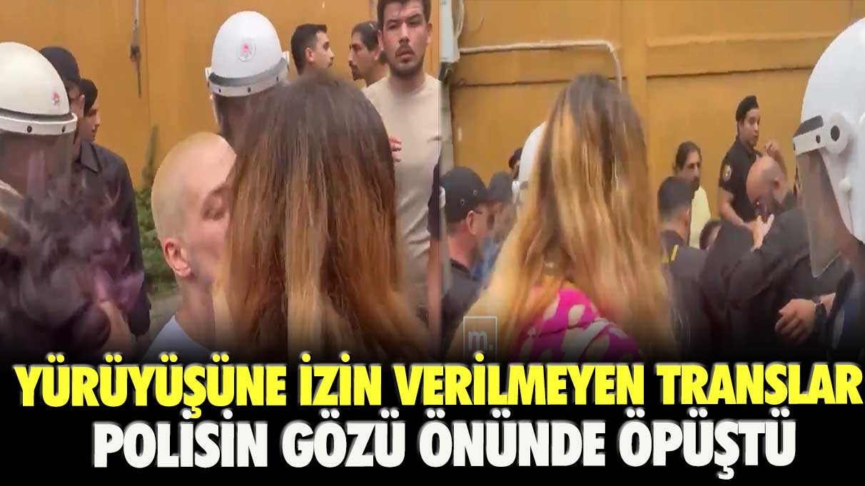 Yürüyüşüne izin verilmeyen translar polisin gözü önünde öpüştü