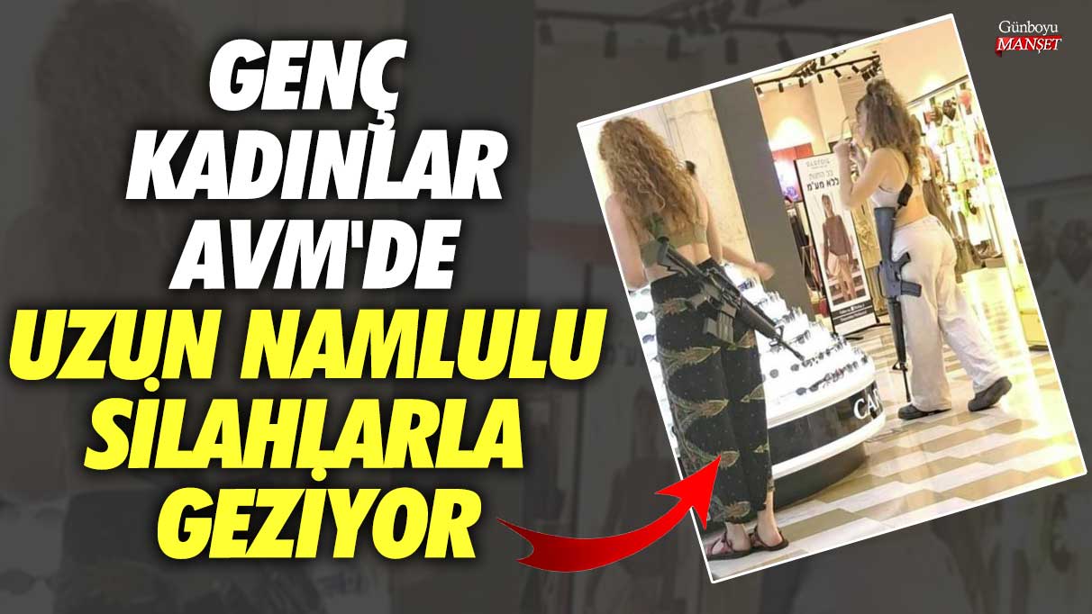 Genç kadınlar AVM'de uzun namlulu silahlarla geziyor