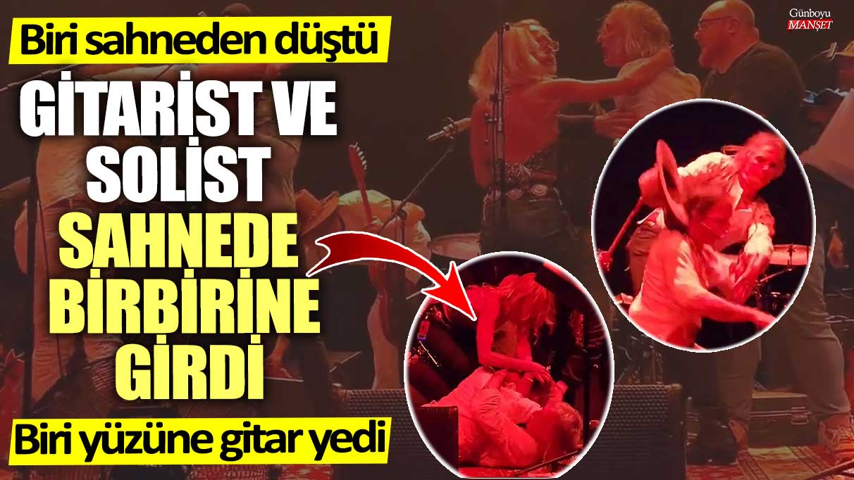 Gitarist ve solist sahnede birbirine girdi! Biri sahneden düştü, biri yüzüne gitar yedi