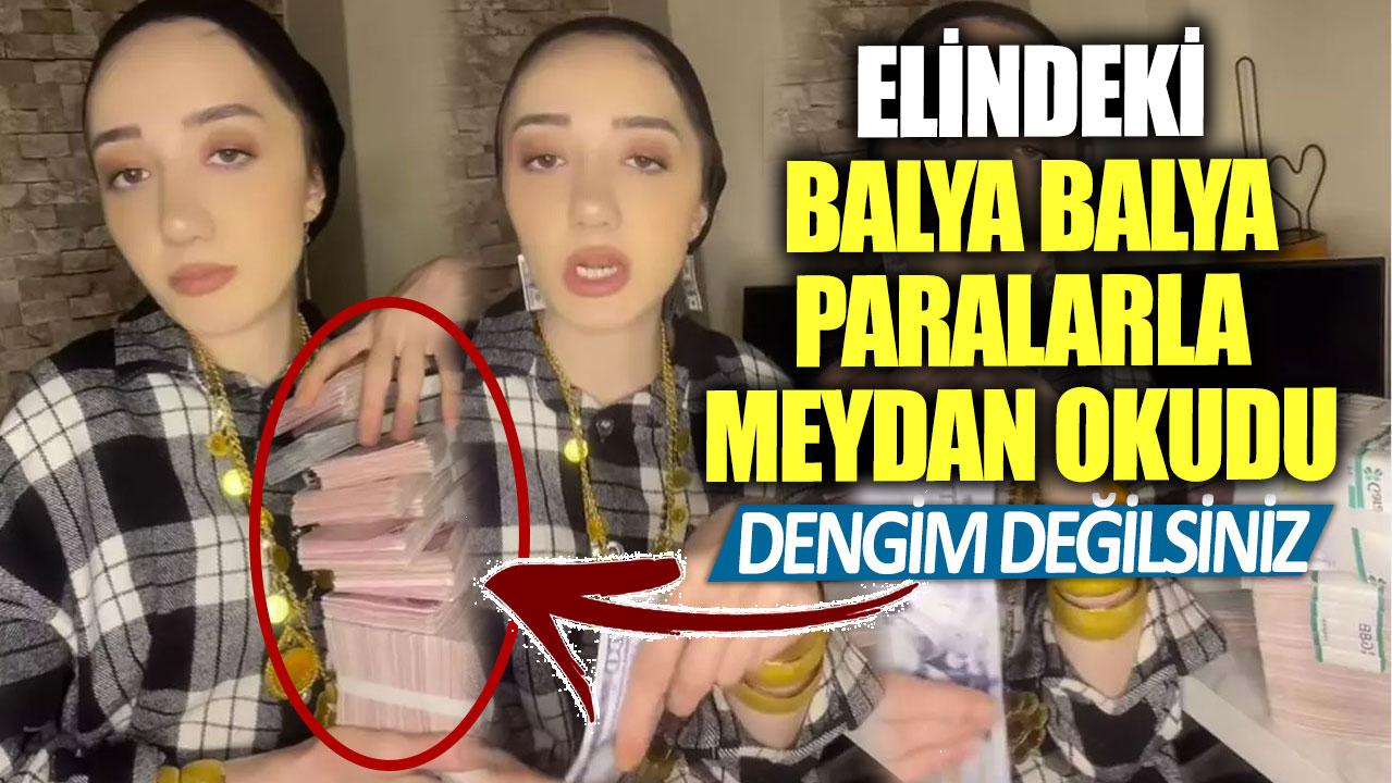 Elindeki balya balya paralarla meydan okudu!  Dengim değilsiniz