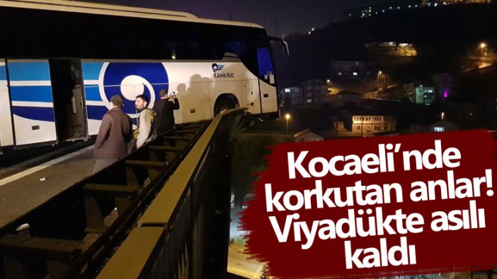 Kocaeli'de korkutan anlar! Refüje çarpan otobüs viyadükte asılı kaldı