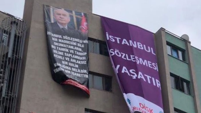 Kocaeli'de aynı binada afişler savaşı! Bu kez MHP'den hamle geldi