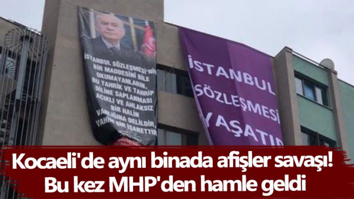 Kocaeli'de aynı binada afişler savaşı! Bu kez MHP'den hamle geldi