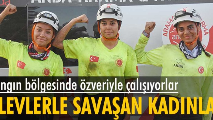 Muğla'da yangın bölgesinde alevlerle savaşan kadınlar...