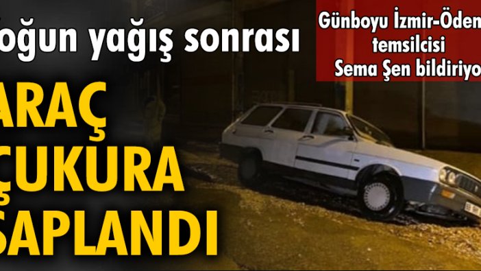 Yoğun yağış sonrası, araç çukura saplandı