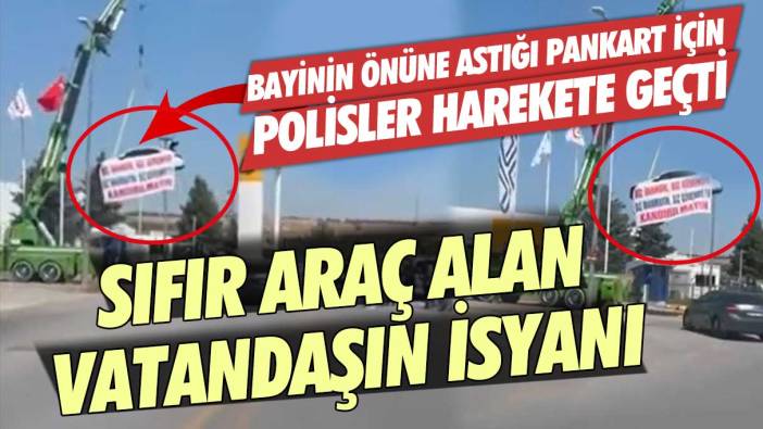 Aldığı araba arızalı çıkınca, arabayı bayinin önüne vinç ile astı