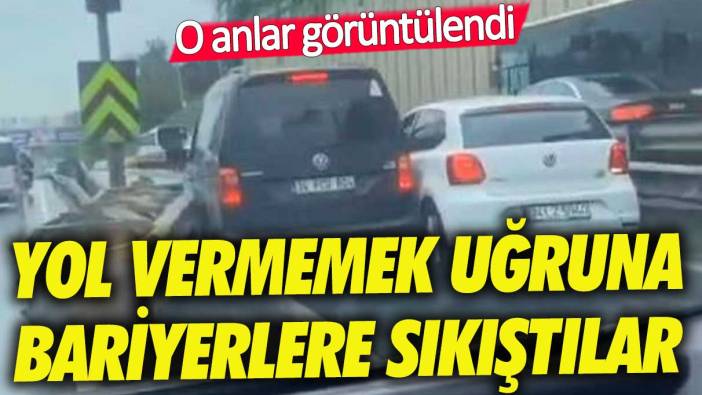 İki inatçı sürücü yol vermemek için bariyerlere sıkıştı!