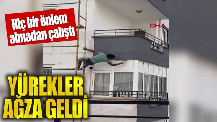 İskeleden sarkarak boya yaptı! Görenlerin yürekleri ağzına geldi