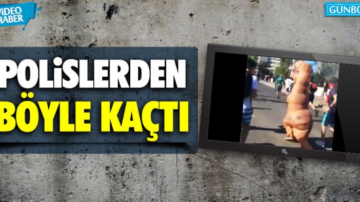 Şili'de eylemci polislerden dinozor kostümüyle kaçtı