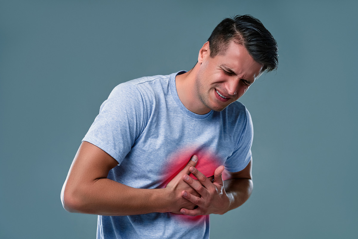 man-white-t-shirt-with-heart-pain-gray-room-1.jpg