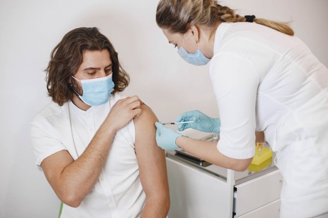 woman-doctor-gives-a-vaccine-to-patients-jldj6vv-1030x686.jpg